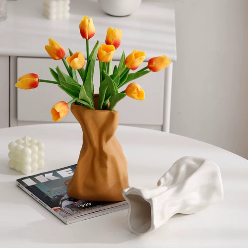 Cream-colored ceramic vase ornaments