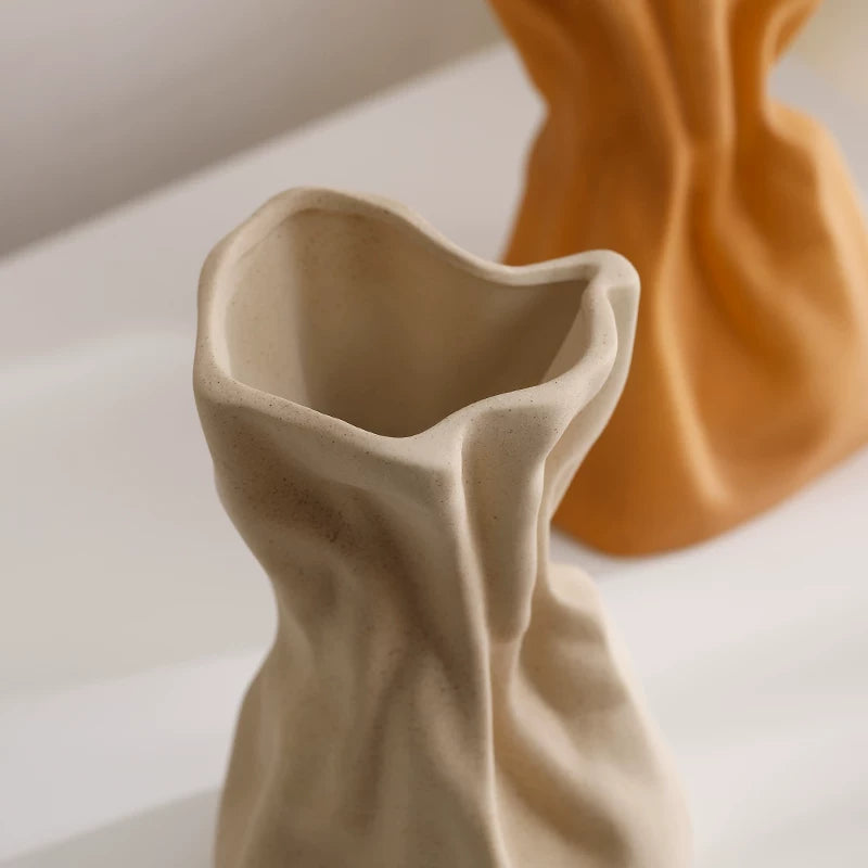 Cream-colored ceramic vase ornaments